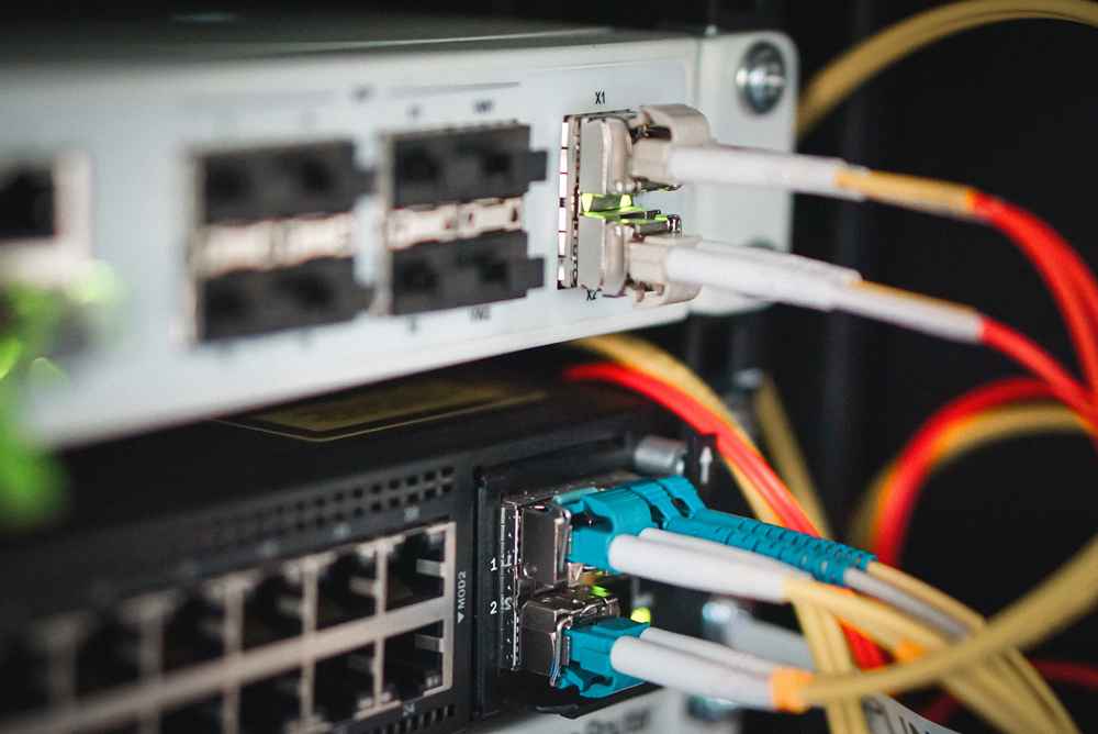 connect the optical gigabit sfp module and fiber optic cable on the networking switch in the data center room